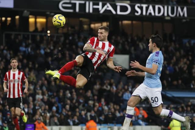 Sheffield United's Billy Sharp hits the woodwork at Manchester City