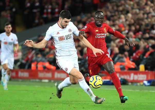 Sheffield United's John Egan in action against Liverpool (Picture: PA)