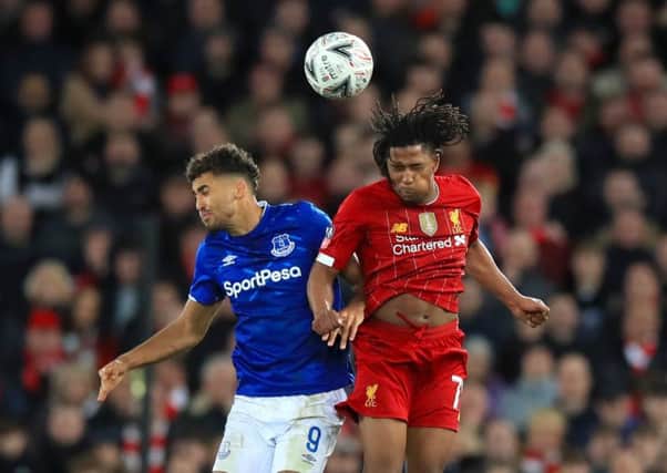 Everton's Dominic Calvert-Lewin (left) and Liverpool's Yasser Larouci battle for the ball during the FA Cup third round match at Anfield (Picture: PA)