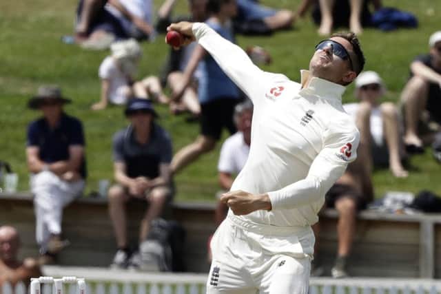 England's Joe Denly bowls during play on day two of the second cricket test between England and New Zealand at Seddon Park in Hamilton. (AP Photo/Mark Baker)