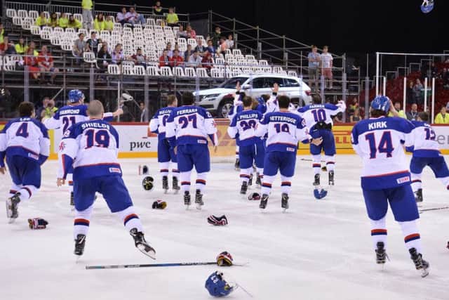 MAGIC MOMENT: GB's players jump off the bench to celebrate after sealing gold and promotion to the World Championship top tier in Budapest in April 2018. Picture: Dean Woolley.