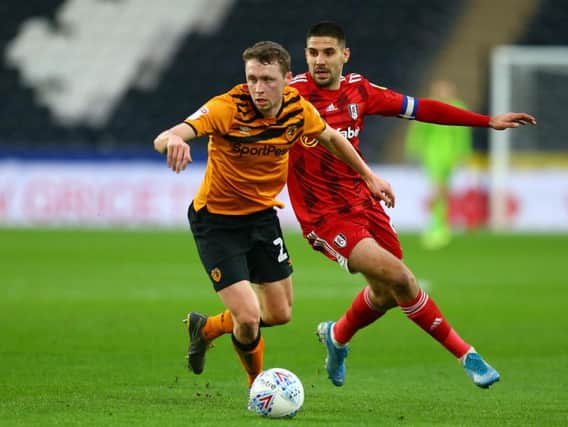 Hull City defender Matthew Pennington gets to the ball ahead of Fulham's Aleksandar Mitrovic during Saturday's Championship clash at the KCOM Stadium. Picture: Getty Images