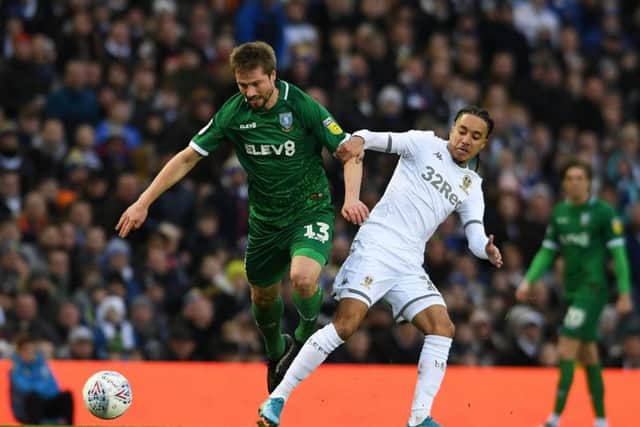 Sheffield Wednesday's Julian Borner challenges Helder Costa of  Leeds United for the ball