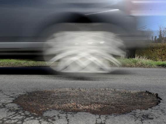 The County Councils Network, representing 36 authorities in England, says shire counties get disproportionately low funding to fix roads and potholes. PA Images.