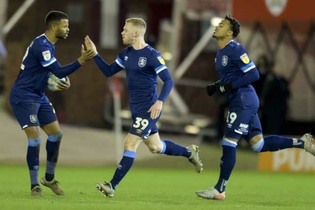 Stunner: Huddersfield's Lewis O'Brien celebrates after scoring.