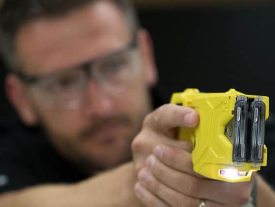 The Home Office has pledged to ringfence a 10m fund to put more officers carrying tasers on the nation's streets. PA Images.