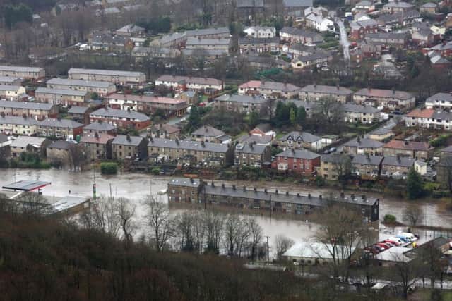 Mytholmroyd centre under water after the River Calder burst its banks. Picture: Charles Round.