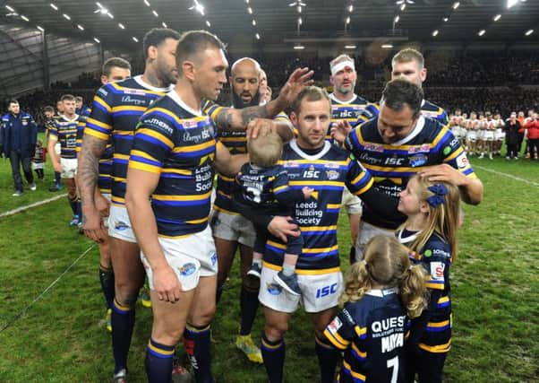 Rob Burrow with his children and former Leeds Rhins team-mates.