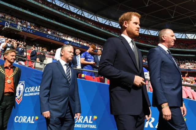 Prince Harry, The Duke of Sussex at Wembley,  and CEO of The Rugby Football League Ralph Rimmer lead the teams out for the 2019 Challenge Cup final (Picture: Simon Wilkinson/SWPix.com)