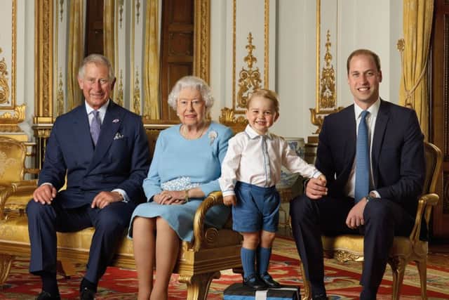 The Queen with Prince Charles, Prince William and Prince George in a rare photo to illustrate the line of succession.