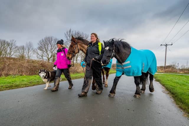 (left to Right) Sarah Kekoa, (Founder of Autism Angels and I Choose Life Foundation)  , walking with horse Akua, and dog Yume, alongside Nicky Hall, Leader Facilitator, for Autism Angels, holding horse Riley, pictured as they heading towards the village of Hutton Cranswick, before stopping in Driffield, East Yorkshire.
