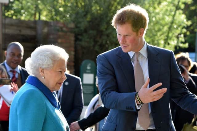 Queen Elizabeth II and Prince Harry attend at the annual Chelsea Flower show  (Photo by Julian Simmonds - WPA Pool / Getty Images)
