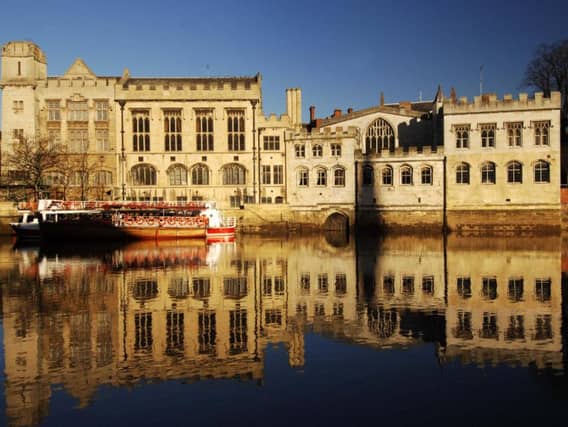 York Guildhall, with the door to the hidden passageway Common Hall Lane visible just above the water line