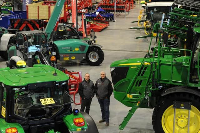 Ian Mcpherson and Danny Robinson with machinery on display at the two day show