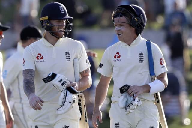 Ollie Pope walks off with Ben Stokes on the first Test. (AP Photo/Mark Baker)