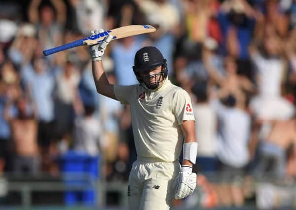 England batsman Ollie Pope reaches his 50 during Day One of the Second Test between England and South Africa in Cape Town, South Africa. (Picture: Stu Forster/Getty Images)