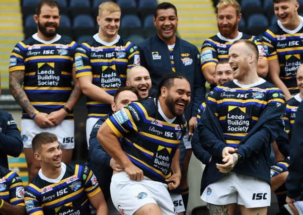 All smiles: Konrad Hurrell, centre, and Dom Crosby, right, share a joke at the Leeds Rhinos pre-season photocall yesterday. (Picture: Jonathan Gawthorpe)