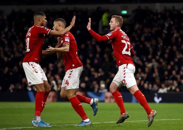 Middlesbrough's George Saville, right, celebrates scoring his side's goal against Spurs.