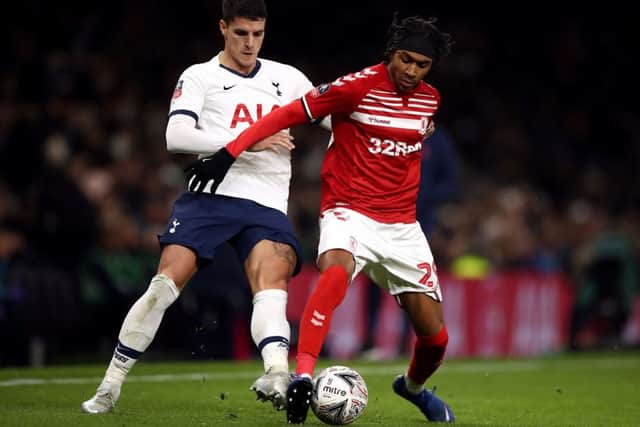 Tottenham Hotspur's Erik Lamela (left) and Middlesbrough's Djed Spence battle for the ball during the FA Cup third round replay match at Tottenham Hotspur Stadium, London. (PIcture: Tim Goode/PA Wire)
