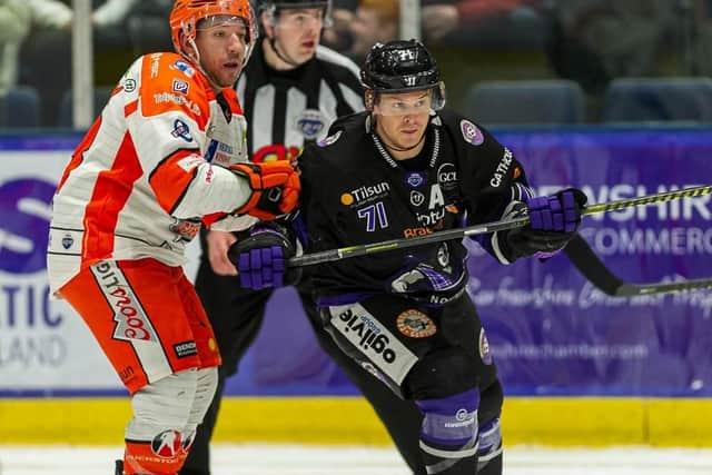 Brendan Connolly battles with Craig Peacock during Wednesday night's first leg in Glasgow. Picture courtesy of Al Goold/EIHL.