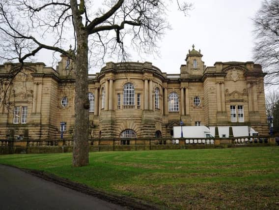 Film crew vehicles outside Cartwright Hall