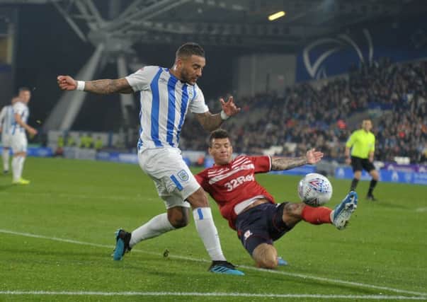 Huddersfield Town's Danny Simpson battles with Middlesbrough's Marvin Johnson. (Picture: Tony Johnson)