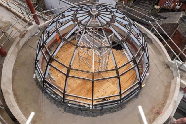 Construction of the glass dome at the top of the lightwell at the Majestic
