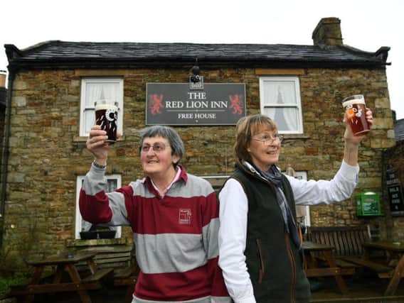 Sisters Rowena Hutchinson and Marguerita at the Red Lion, Langthwaite. Six-month anniversary of floods in the Dales.