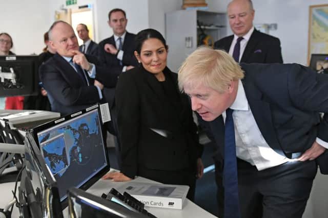 Home Secretary Priti Patel with Prime Minister Boris Johnson during the election. Photo: Stefan Rousseau/PA Wire
