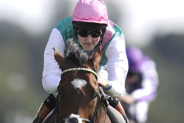 Tom Queally abord Frankel in the 2012 Juddmonte International at York.