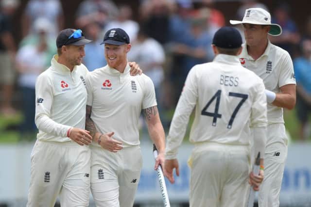 England captain Joe Root, left, shares a joke with Ben Stokes as the tourists celebrate the final wicket and victory in Port Elizabeth. Picture: Stu Forster/Getty Images