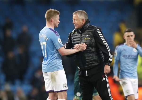 Sheffield United manager Chris Wilder (right) speaks with Manchester City's Kevin De Bruyne after the final whistle during the Premier League match at The Etihad Stadium. Picture: Martin Rickett/PA