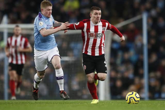Manchester City's Kevin De Bruyne challenges Sheffield United John Fleck at the Etihad Stadium earlier this season. Picture: Simon Bellis/Sportimage