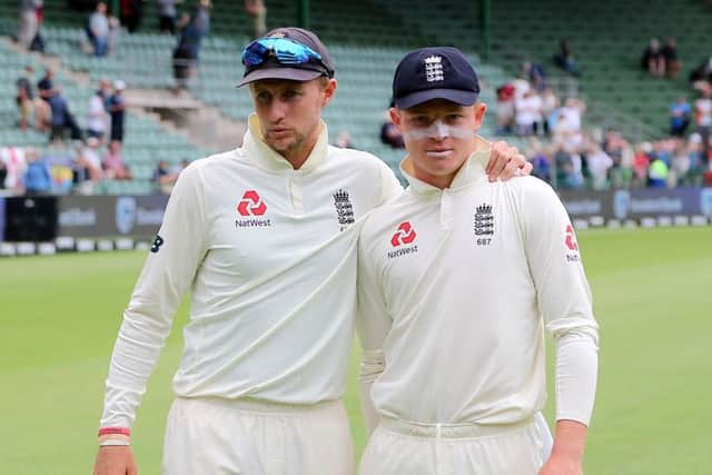 England's Joe Root left and Ollie Pope in Port Elizabeth. Picture: Richard Huggard/Getty Images.