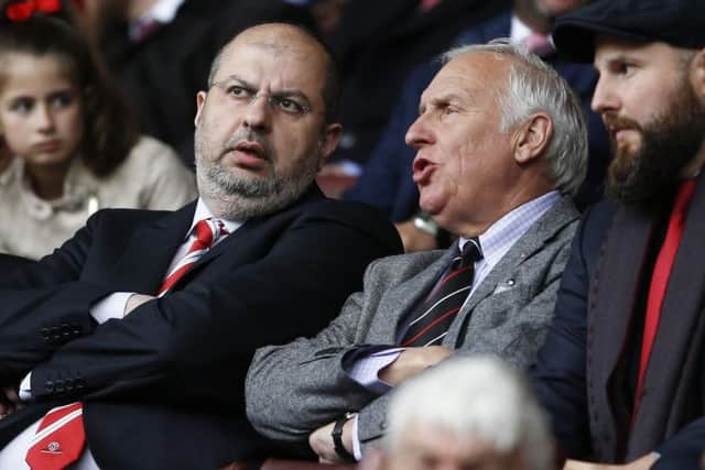 Prince Abdullah, left, sat in the stands at Bramall Lane with Kevin McCabe.