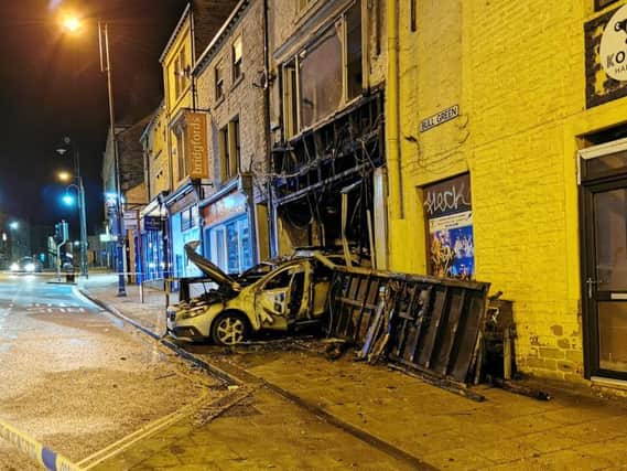 The silver Volvo was reversed into the building and set alight, police have confirmed.