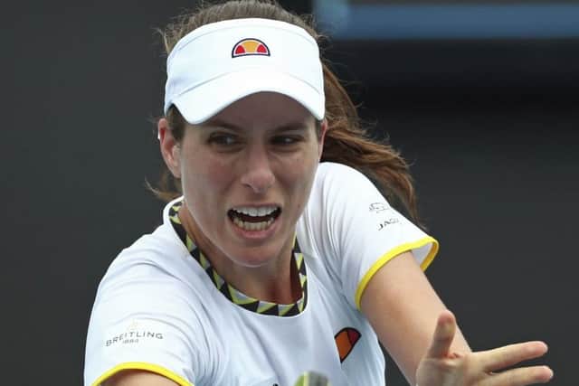 Johanna Konta makes a backhand return to Tunisia's Ons Jabeur at the Australian Open in Melbourne. Picture: AP/Dita Alangkara