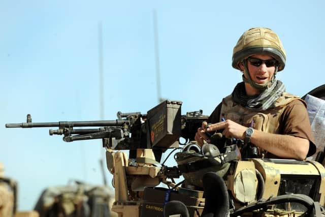 Prince Harry sits in his position on a Spartan armoured vehicle in the Helmand province, Southern Afghanistan in 2008.  Photo credit: John Stillwell/PA Wire