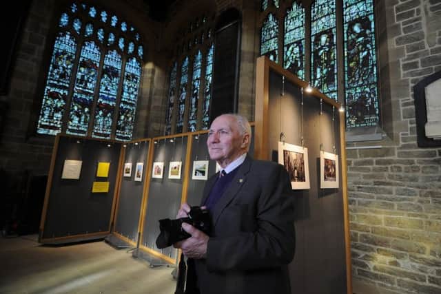 Photographer Brian Goodall, who is blind, is pictured with his exhibition of photographs at Wakefield Cathedral.