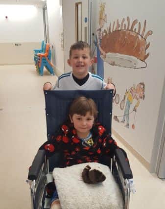 Bobby with his big brother Archie at Sheffield Children's Hospital after knee surgery