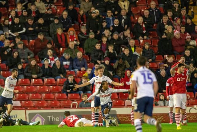 Preston celebrate their second goal at Oakwell. PIC: Bruce Rollinson.