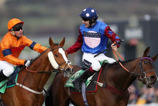 Joe Colliver aboard Sam Spinner (left) congratulates Aidan Coleman after the Stayers' Hurdle success of Paisley Park.