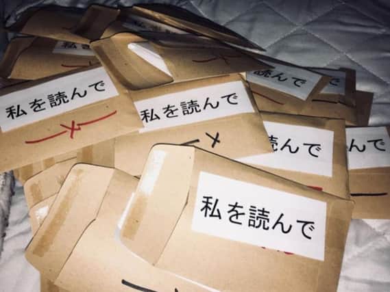 Found Fiction envelopes with a translated message on the outside.