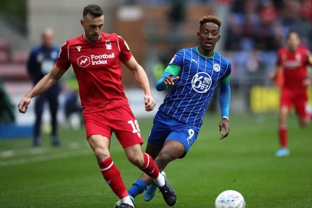 NEW FACE: Jack Robinson (left), in action for Nottingham Forest against Wigan Athletic earlier this season. Picture: Tim Goode/PA
