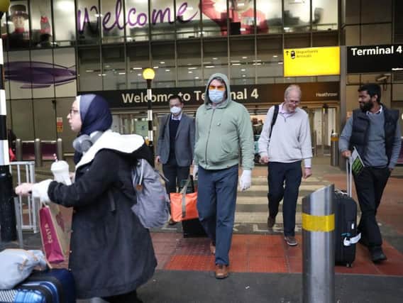 Passengers arrive at Heathrow. PIC: PA