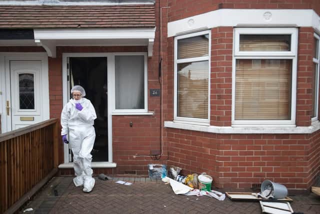 Forensics officers at the scene of a fire at a house on Wensley Avenue, Hull, where two people have died, including an eight-year-old. Danny Lawson/PA Wire