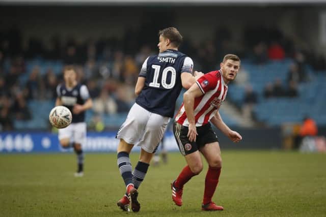 Jack O'Connell battles against Millwall's Matt Smith. Picture: Robin Parker/Sportimage
