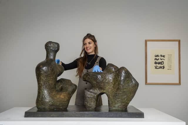 Clare Nadal, Assistant Curator at the Hepworth Gallery in Wakefield with Henry Moore's Reclining Figure N.o.4 which forms part of a new exhibition to open in February featuring work by the artist and incorporating images by photographer Bill Brandt.  Picture Tony Johnson