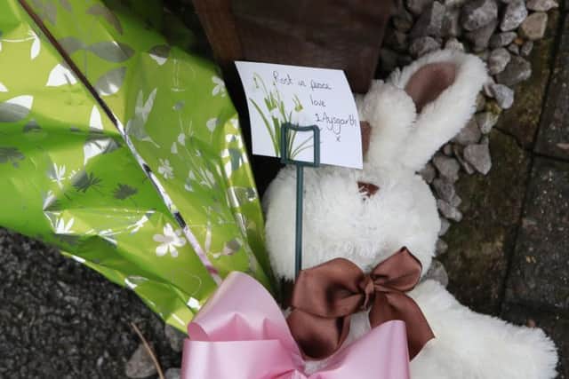 Tributes left at the scene of the fatal house fire in Wensley Avenue, Hull.