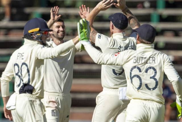MAIN MAN: England's bowler Mark Wood, second left, celebrates after dismissing South Africa's Quinton de Kock on day four at the Wanderers. Picture: AP/Themba Hadebe